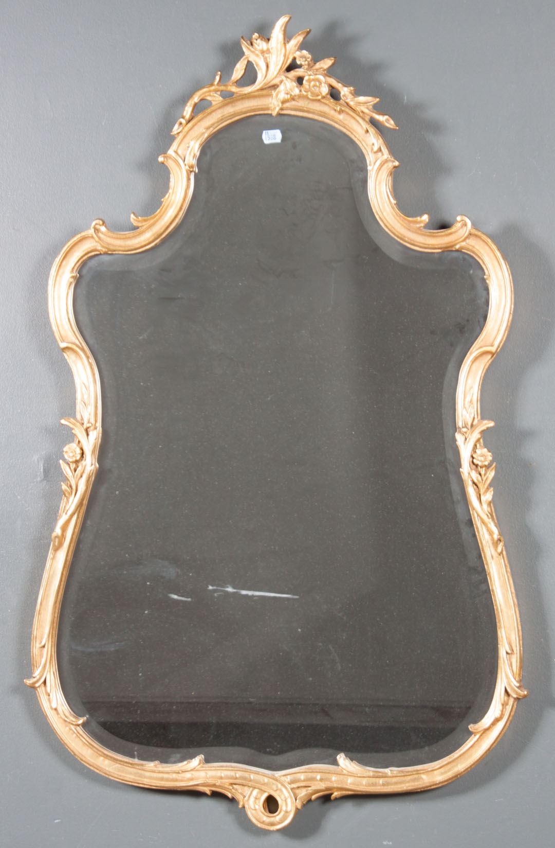 Appraisal: Rococo style giltwood mirror th century with beveled glass and