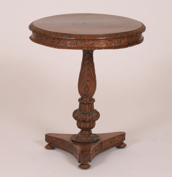 Appraisal: Ornately carved late Victorian side table footed triangular base floral