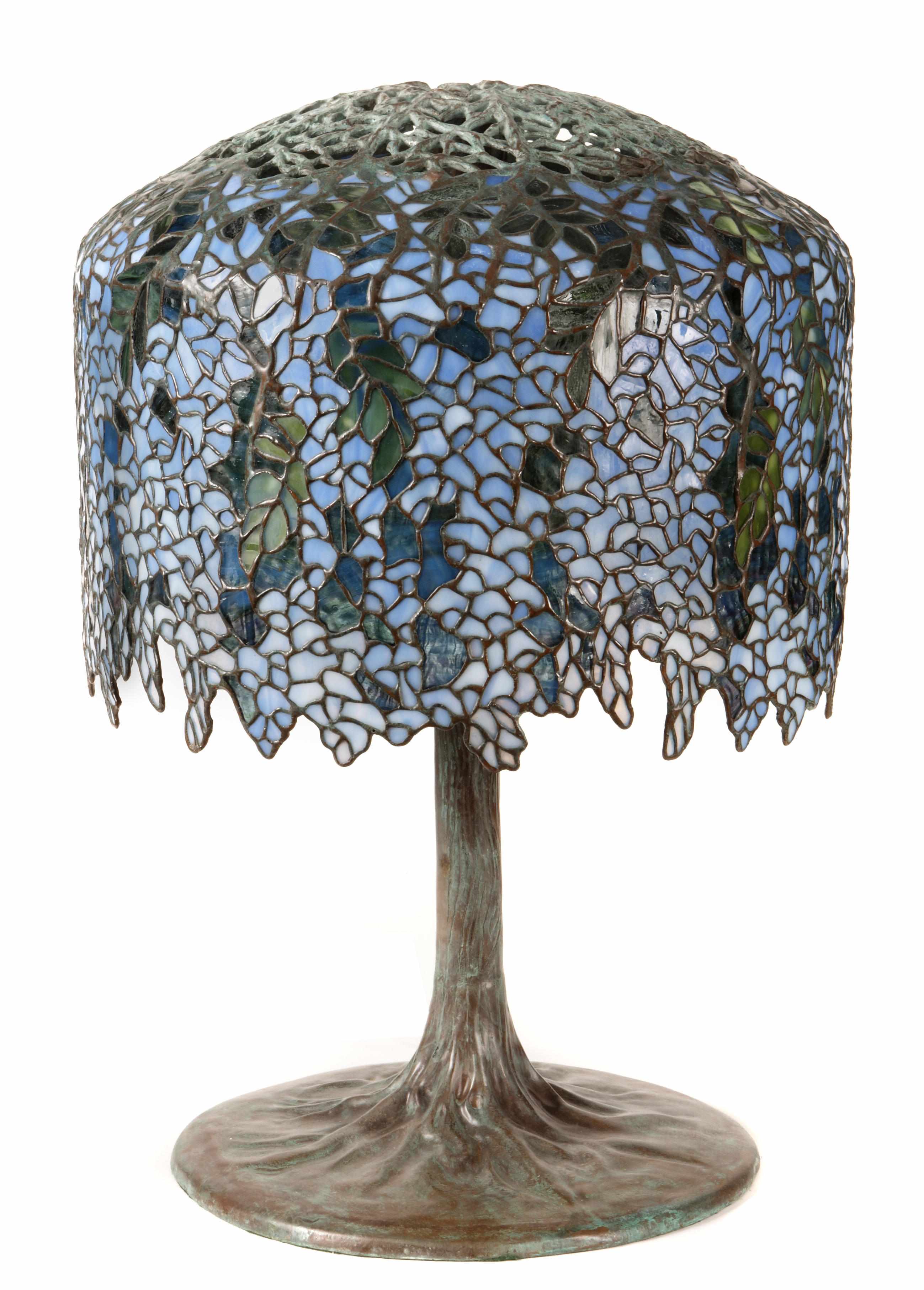 Appraisal: A Tiffany style patinated bronze and leaded glass wisteria lamp