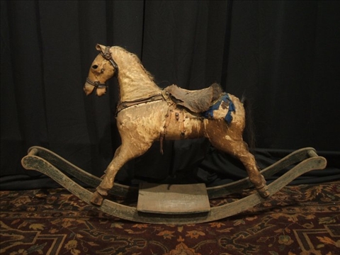 Appraisal: VINTAGE FOLK ART HIDE COVERED ROCKING HORSE With horse hair