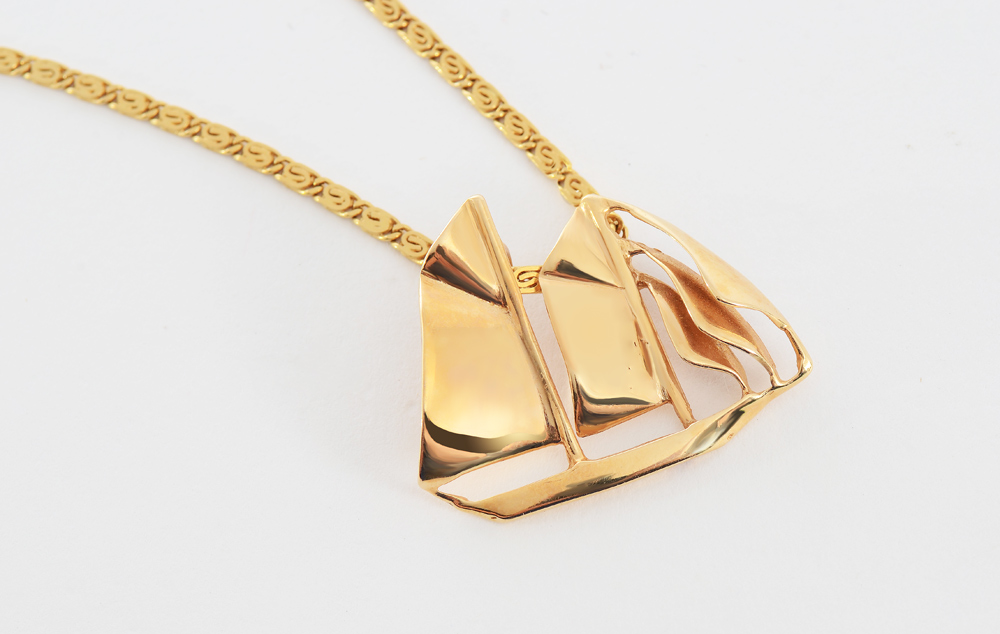 Appraisal: GOLD SAILING YACHT PENDANT NECKLACE K yellow gold '' chain