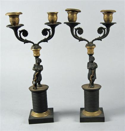 Appraisal: Pair of Charles X patinated and gilt bronze candelabra early