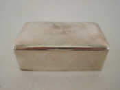 Appraisal: A plain oblong silver cigarette box by Lawrence Emanuel Birmingham