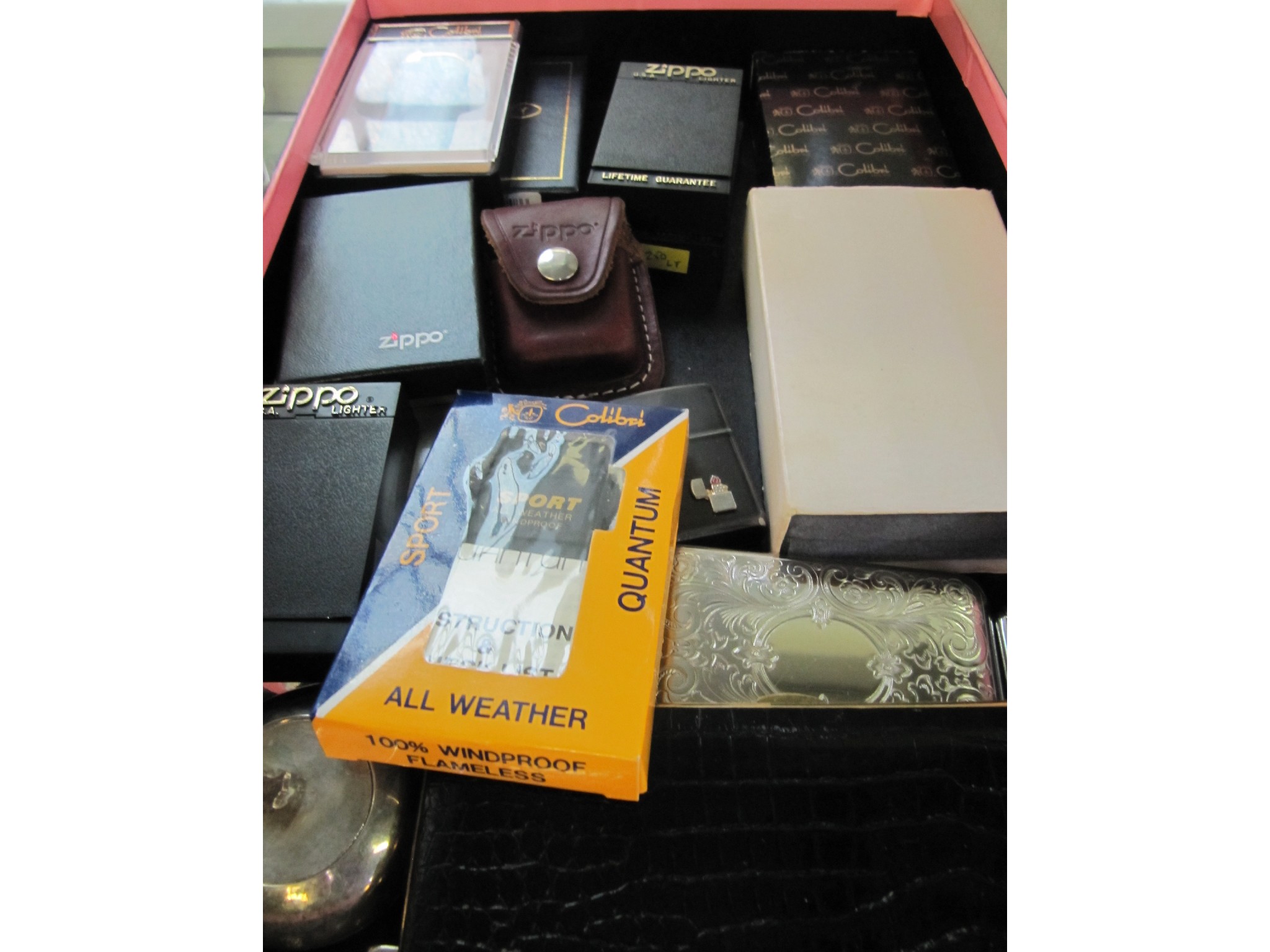 Appraisal: A box of cigarette lighters including Zippo