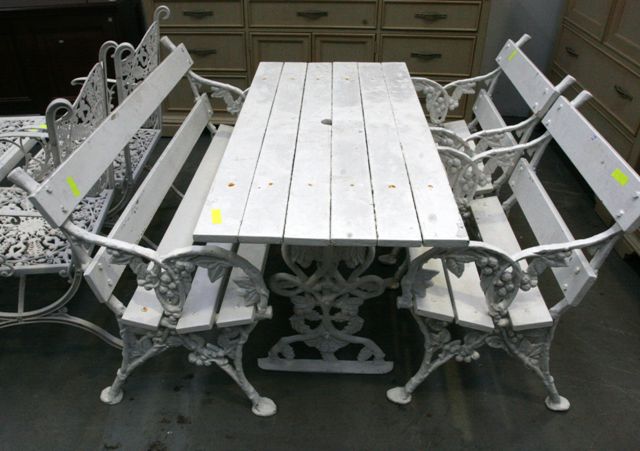 Appraisal: A white painted cast iron table with outdoor table garden