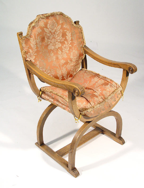 Appraisal: Victorian walnut x-framed open arm chair with uholstered back and