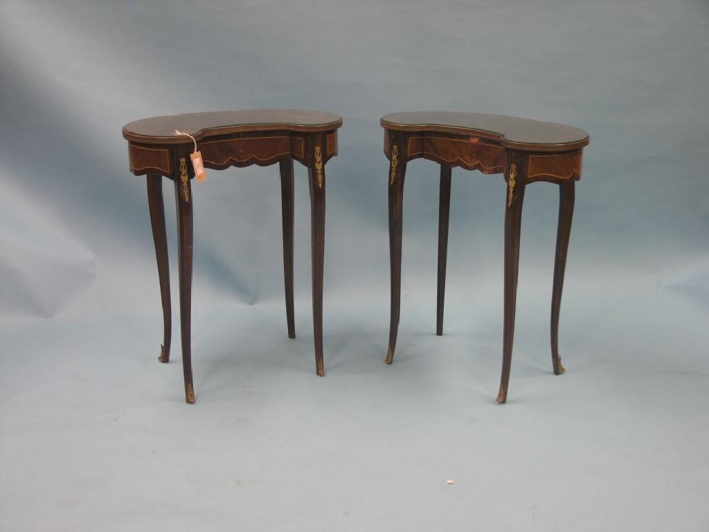 Appraisal: A pair of Louis XV-style mahogany kidney-shape side tables each