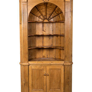 Appraisal: A George III Style Carved Pine Corner Cupboard Height x