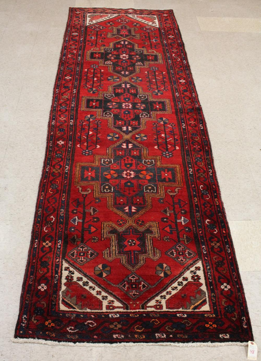 Appraisal: HAND KNOTTED PERSIAN TRIBAL AREA RUG triple cruciform medallion design