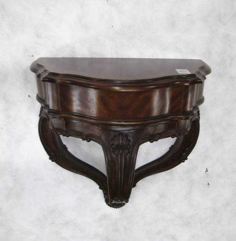 Appraisal: CARVED MAHOGANY WALL BRACKET made in Indonesia for Maitland-Smith Furniture