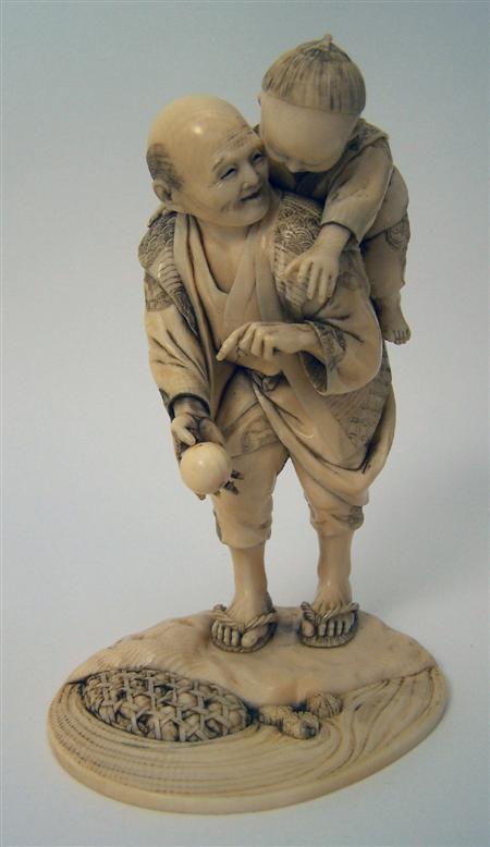 Appraisal: JAPANESE CARVED IVORY FIGURE GROUP MEIJI PERIOD depicting an elderly