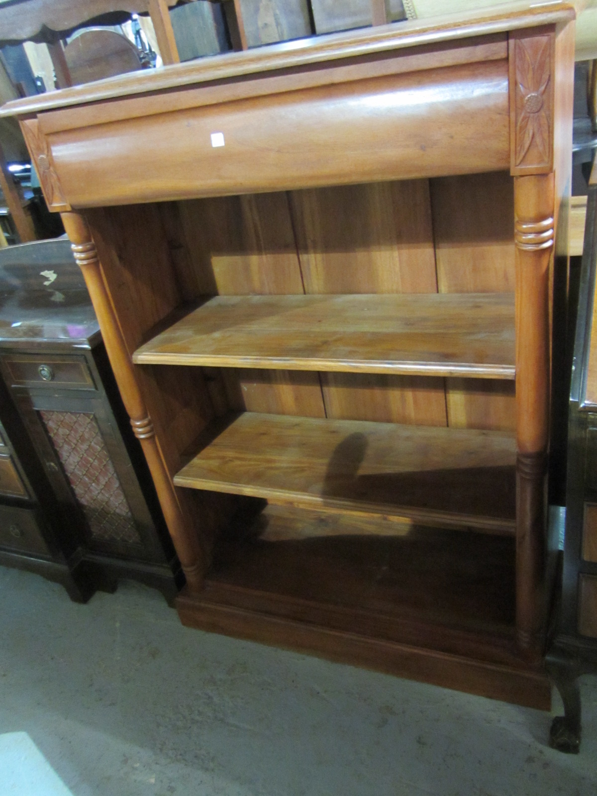 Appraisal: A th century mahogany bookcase with three shelves and drawer