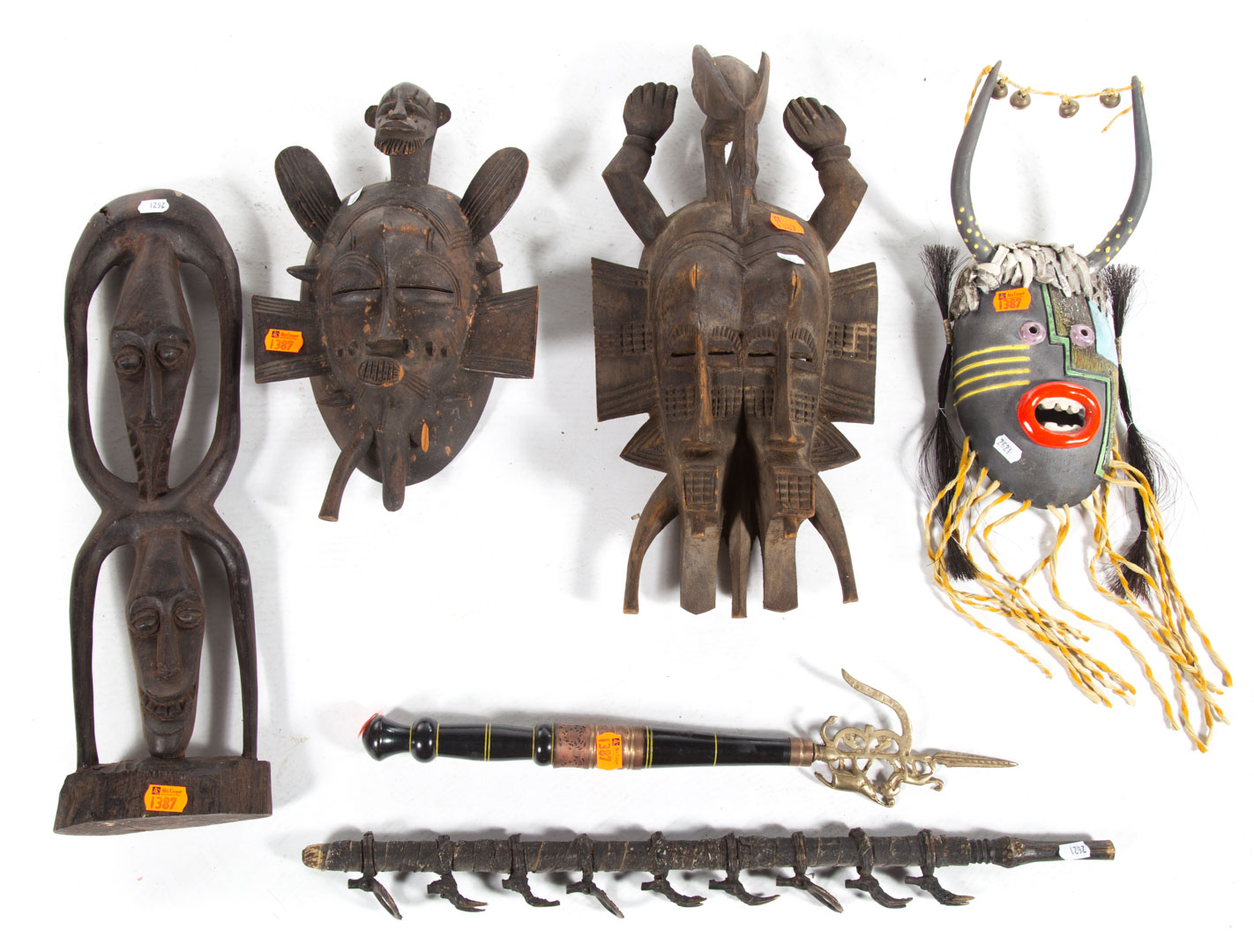 Appraisal: African masks figures weapons Four assorted African wood and pigment