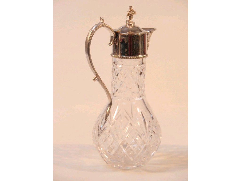 Appraisal: A mounted silver mount cut crystal claret jug with cast