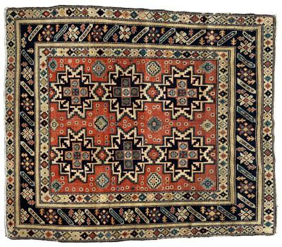 Appraisal: Caucasian rug four geometric central medallions on faded brick red