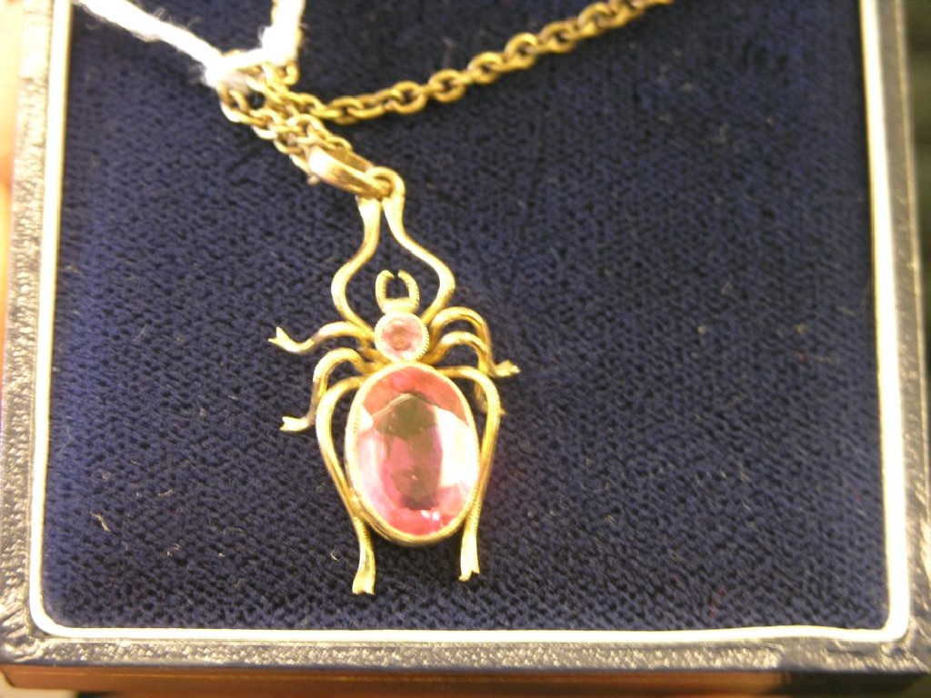 Appraisal: A beetle pendant on chain set two pink stones and