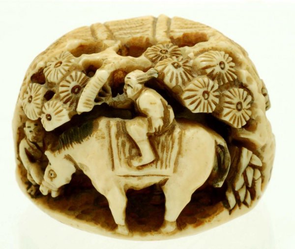 Appraisal: An ivory figural netsuke of two figures and a horse