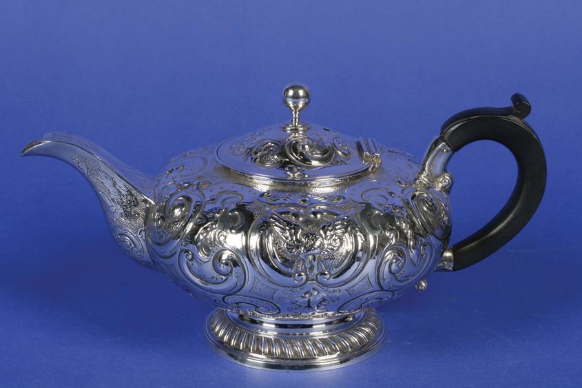 Appraisal: A VICTORIAN TEAPOT of compressed circular form the hinged lid