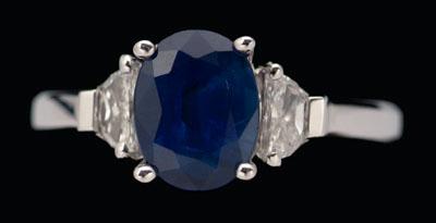 Appraisal: Sapphire diamond ring central oval blue sapphire estimated weight cts