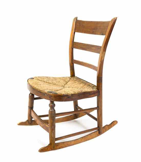 Appraisal: An American Provincial Child's Rocking Chair having three horizontal graduated