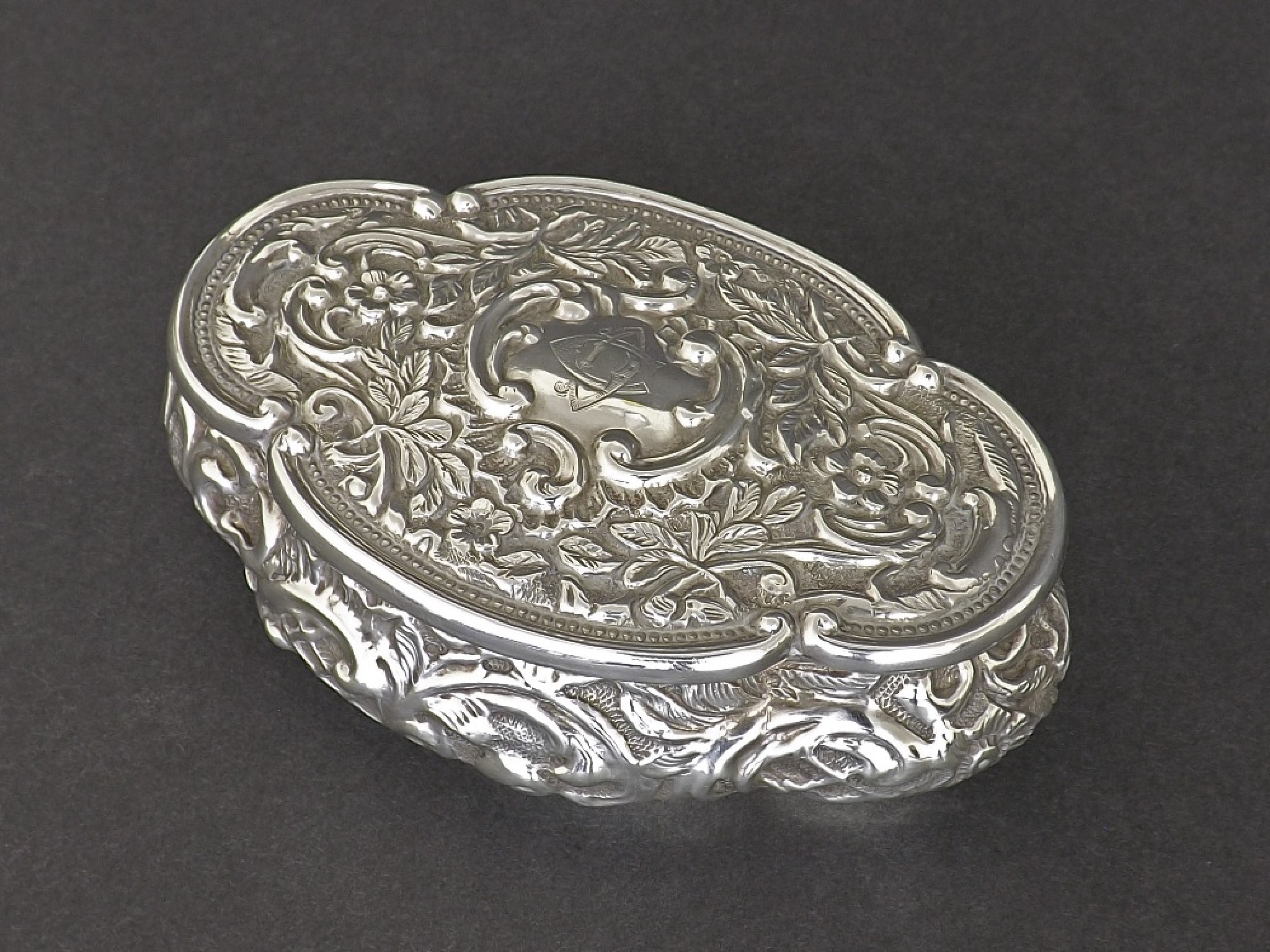 Appraisal: Edwardian silver serpentine embossed trinket dish decorated with scrolled foliage