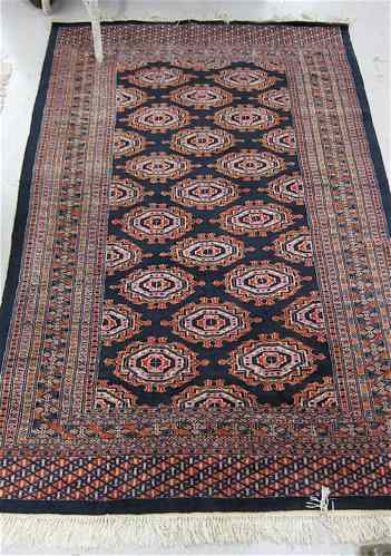 Appraisal: BOKHARA AREA RUG geometric Turkoman design on dark blue ground