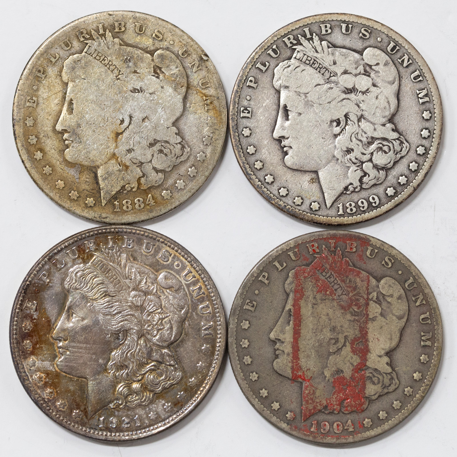 Appraisal: FOUR SILVER DOLLARS AG G -S VG -S G red