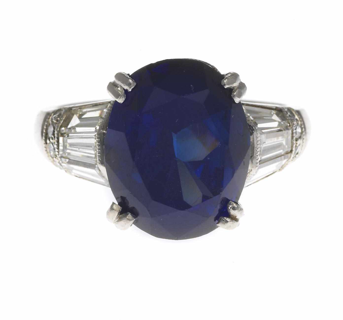 Appraisal: A synthetic sapphire and diamond ring oval-shaped synthetic sapphire weighing