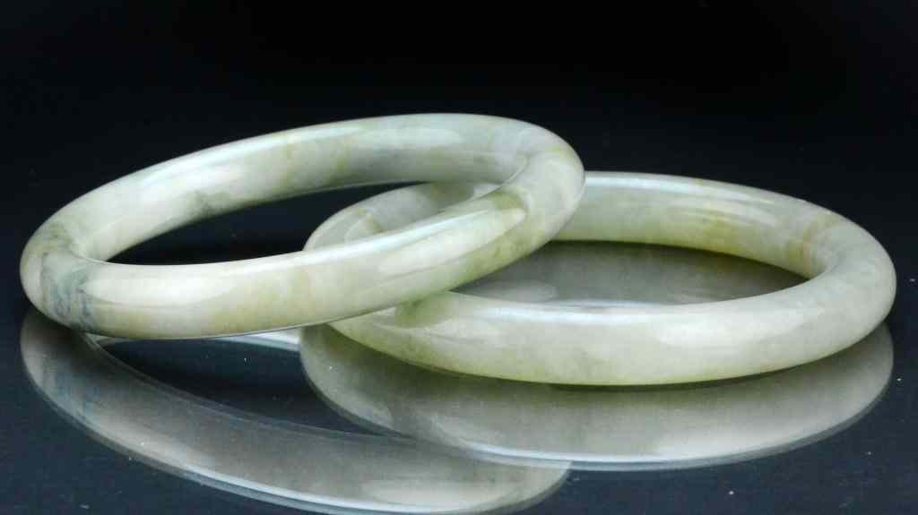 Appraisal: Chinese Qing Jade Bangle BraceletsFinely carved and polished the stone