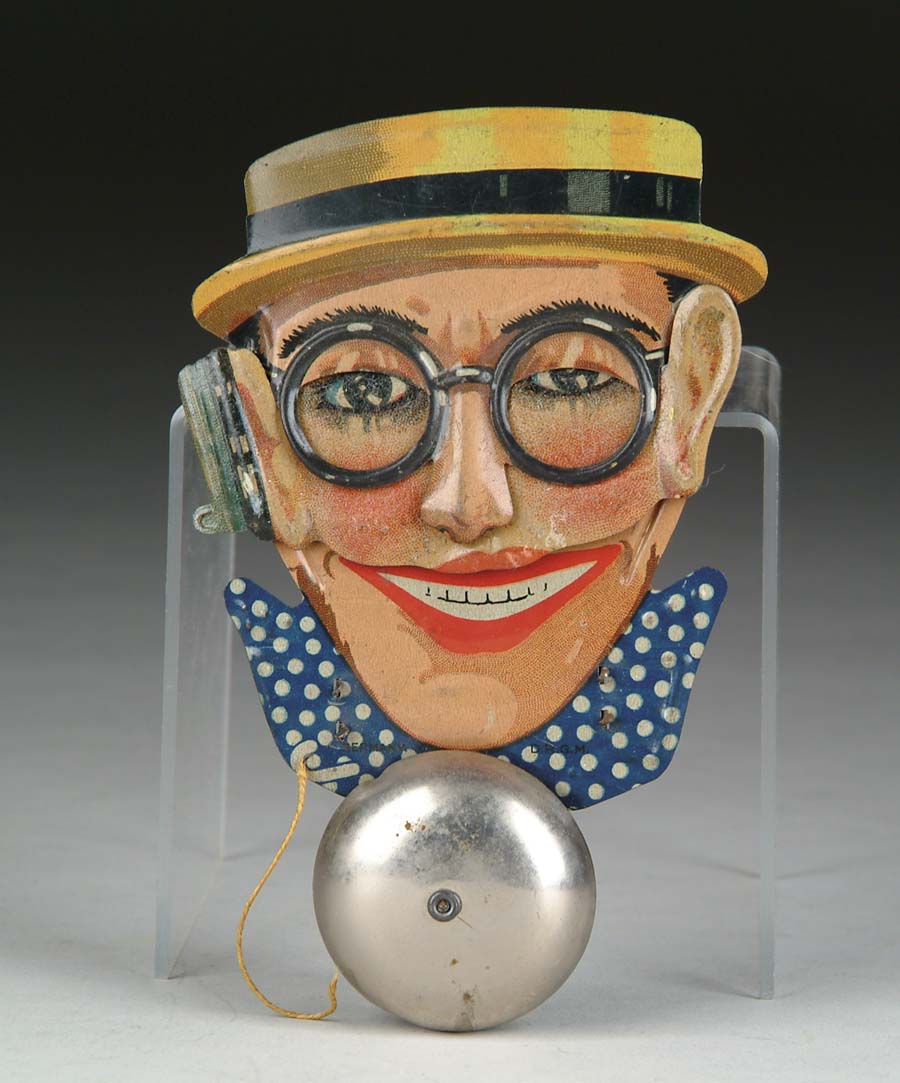 Appraisal: HAROLD LLOYD BELL TOY Germany Beautifully lithographed tin mechanical toy