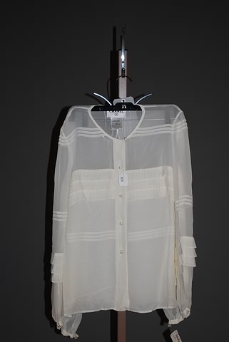 Appraisal: Chanel sheer silk jewel neck long sleeve blouse with ruffles