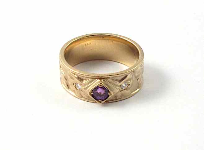 Appraisal: AMETHYST DIAMOND AND FOURTEEN KARAT GOLD BAND the wide band