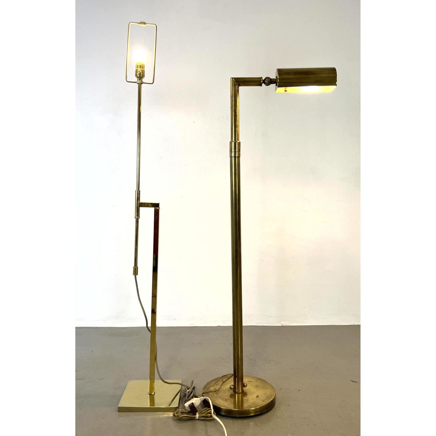 Appraisal: pc Brass Modernist Floor Lamps Each with adjustable Height Dimensions