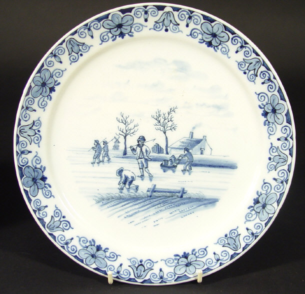 Appraisal: Delft pottery plate hand painted in blue with figures skating