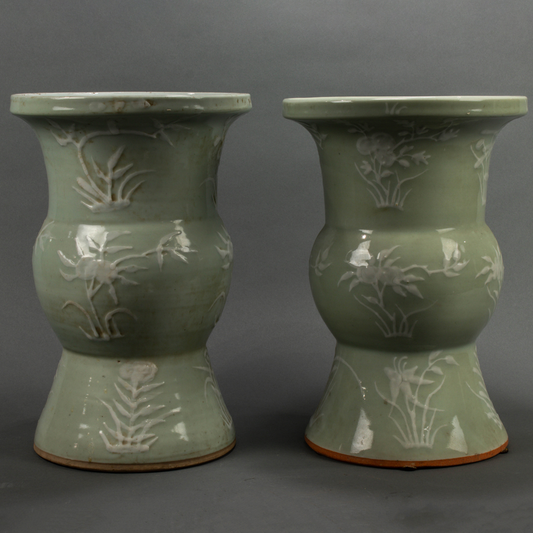 Appraisal: PAIR OF CHINESE CELADON GLAZED AND WHITE SLIP DECORATED VASES