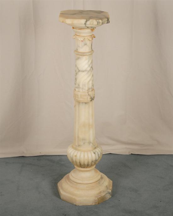 Appraisal: Marble Pedestal variegated and off-white marble carved sectional cylinder octagonal