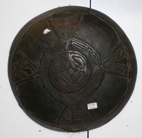 Appraisal: A Papua New Guinea food bowl with traditional carving on