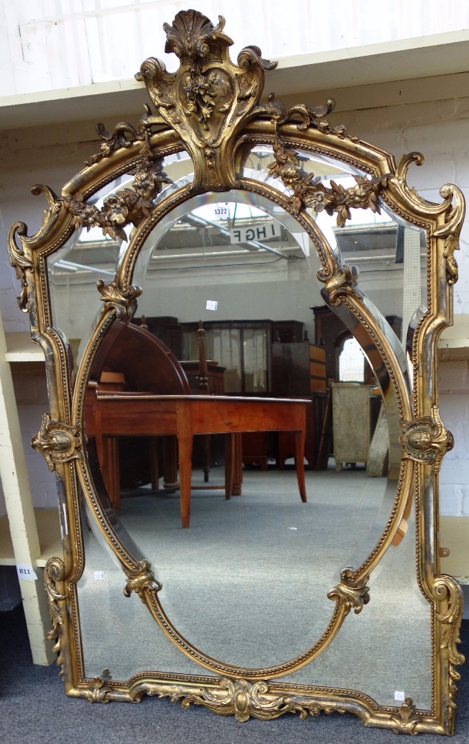 Appraisal: A th century gilt framed overmantel mirror the cartouche crest