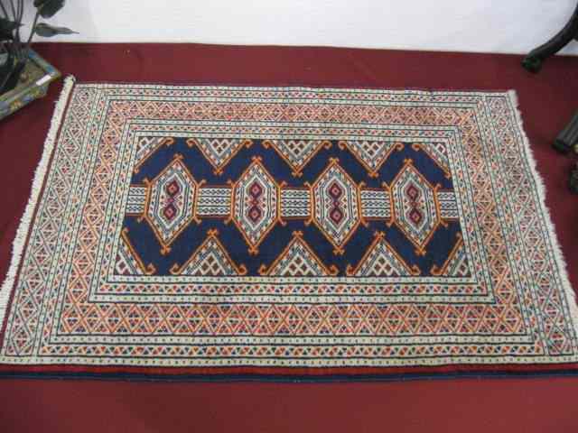 Appraisal: Turkish Handmade Mat geometric designs ivory and reds on indigio