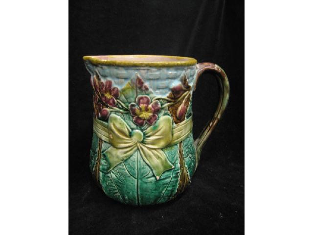 Appraisal: Majolica Pottery Water Pitcher leaf floral design with bow trim