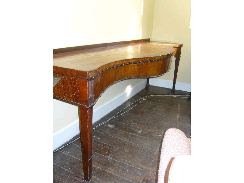 Appraisal: A Georgian mahogany serving table with serpentine front raised on