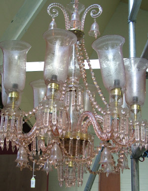 Appraisal: A Persian th century style pale pink crystal eight light