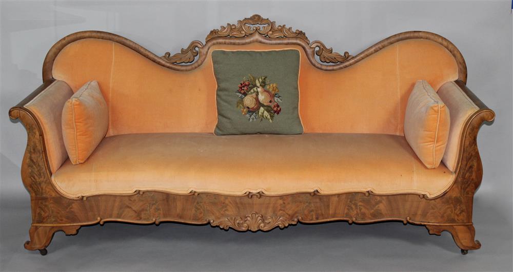 Appraisal: VICTORIAN STYLE CARVED WOOD AND UPHOLSTERED SETTEE the deeply arched