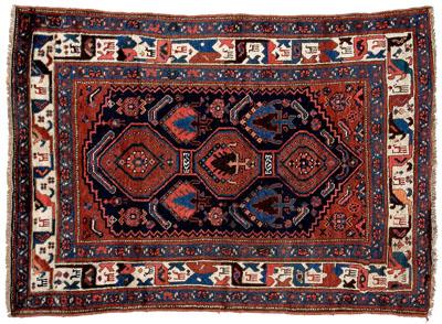 Appraisal: Caucasian rug three connected central medallions on dark blue field