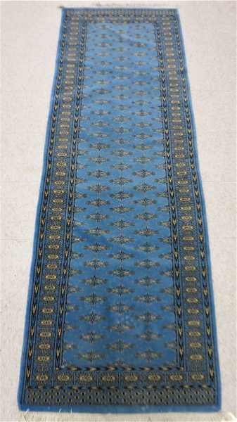 Appraisal: HAND KNOTTED BLUE FIELD BOKHARA RUNNER repeating Turkoman minor gol