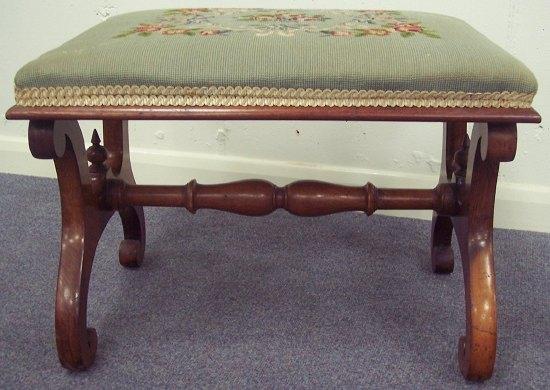 Appraisal: A Victorian walnut rectangular stool on X-shaped support united by