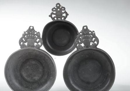 Appraisal: THREE EARLY AMERICAN PEWTER PORRINGERS Comprising two crown handle examples