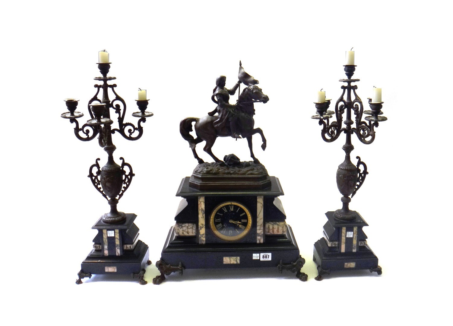 Appraisal: A Victorian black marble and spelter mounted clock garniture surmounted