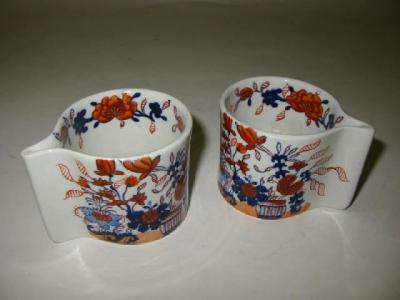 Appraisal: A PAIR OF MASONS IRONSTONE CUSTARD CUPS of comma form