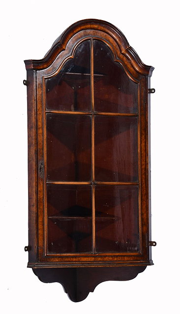 Appraisal: A TH CENTURY WALNUT HANGING CORNER CUPBOARD with shaped top